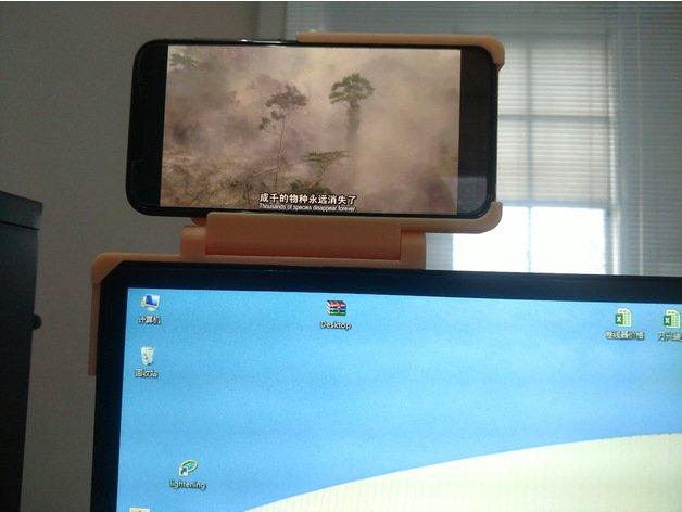 A cellphone mount on monitor 