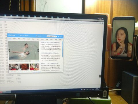 A cellphone mount on monitor