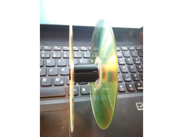 Cargo strap spool with old CDs 