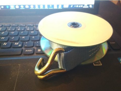 Cargo strap spool with old CDs
