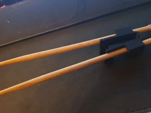 Wearable chopstick trainer
