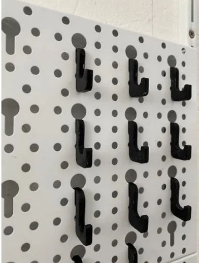 Hook for perforated wall